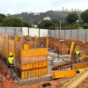 Construction workers building the framework for the cement basement walls of Marina Residence 45.